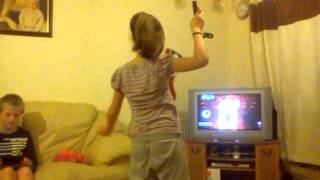 Lili trying to do the belly dance on the wii